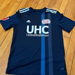 Revolution soccer jersey (boys L) fit 10/12 years old